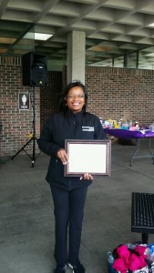 Dr. Gilmer receives a plaque for her work
